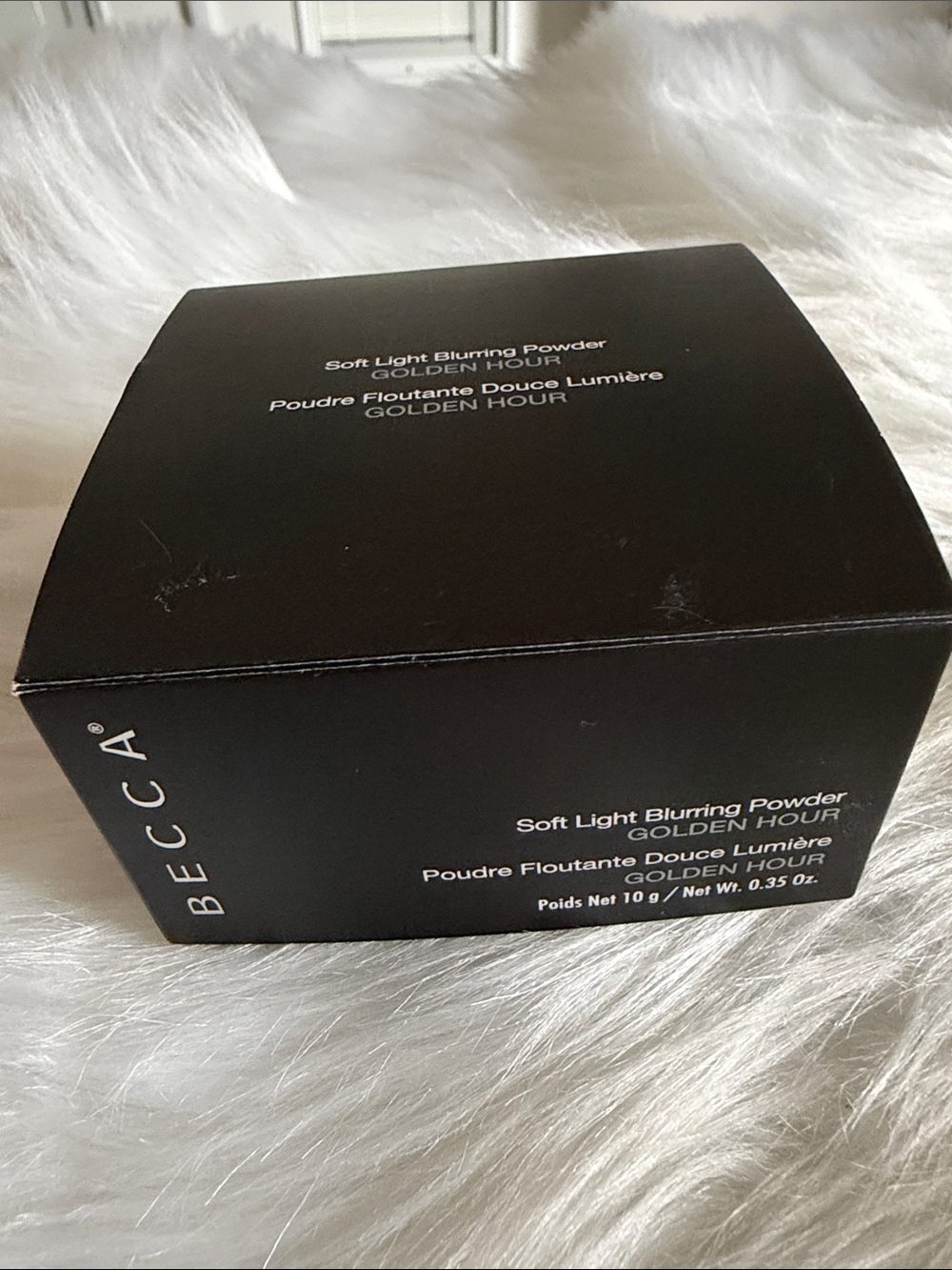 BECCA Soft Light Blurring Powder in Golden Hour - Black Compact Box
